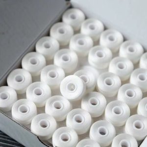 Embroidery prewound bobbin thread
